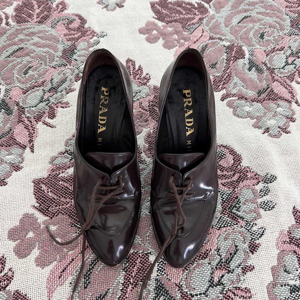 PRADA LACED UP HEEL LOAFERS